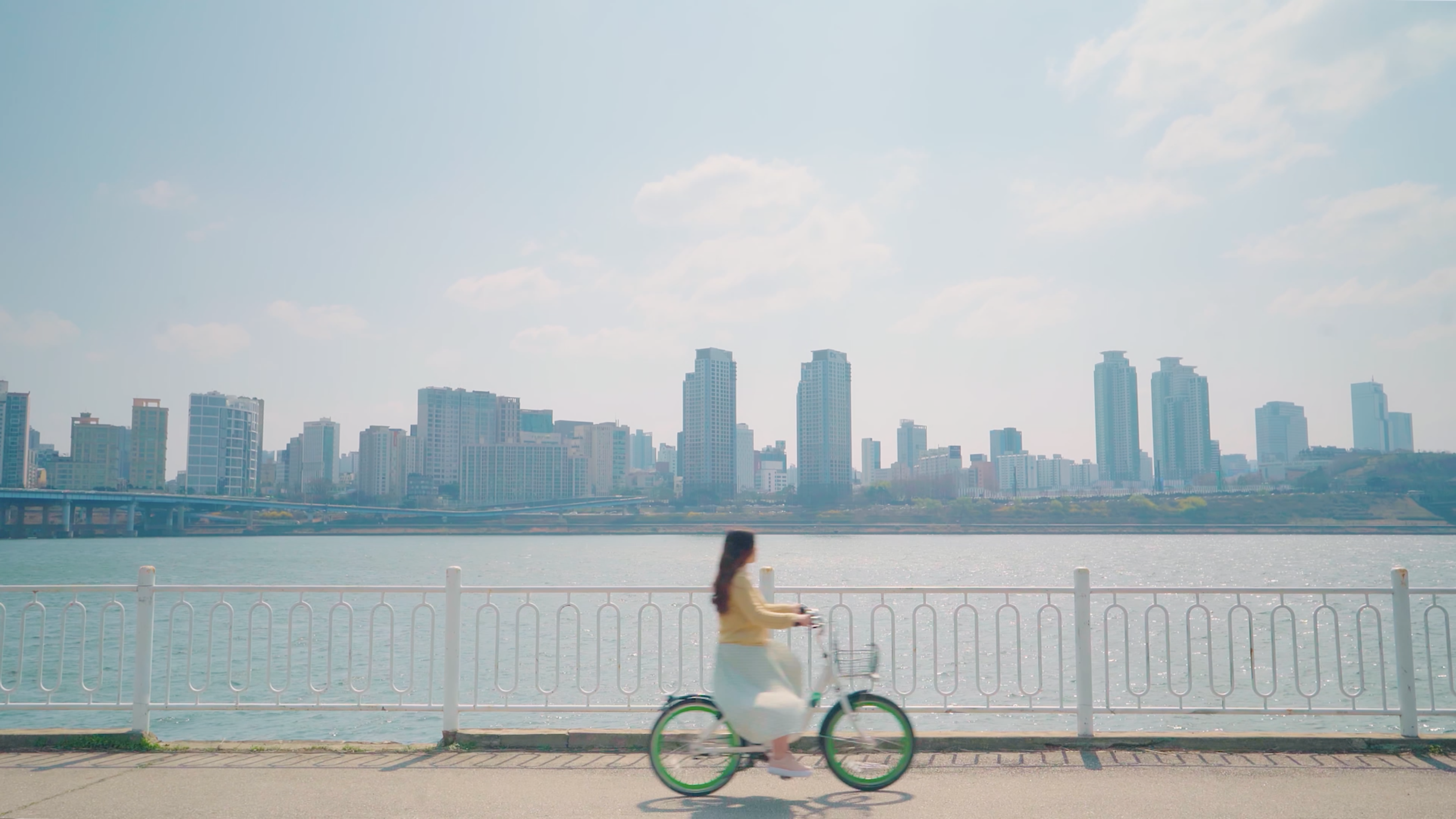 Clarissaa cycling down a path