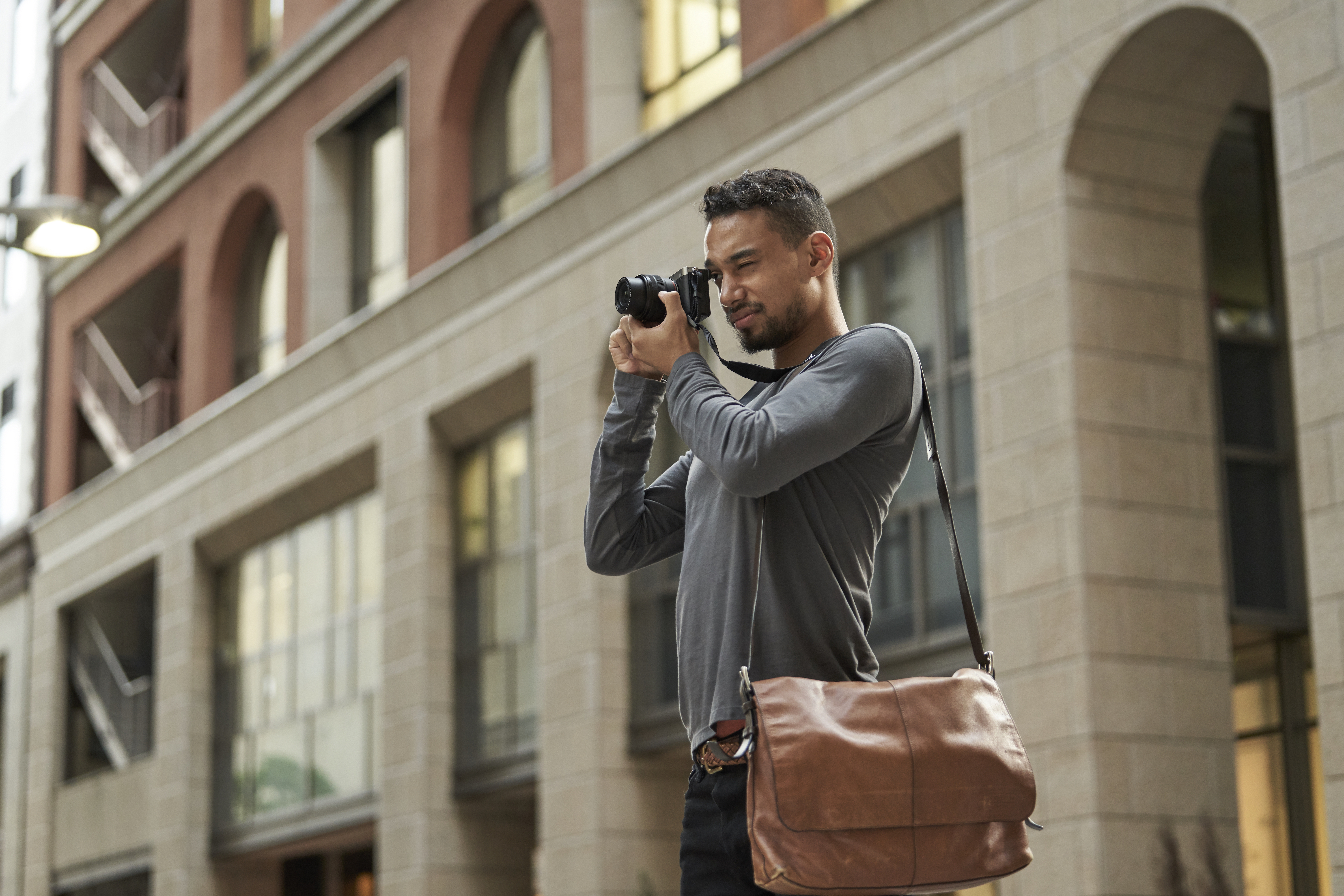 Guy taking photo with Alpha 7C